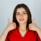 compressed_young-lady-red-blouse-showing-thumbs-up-looking-glad